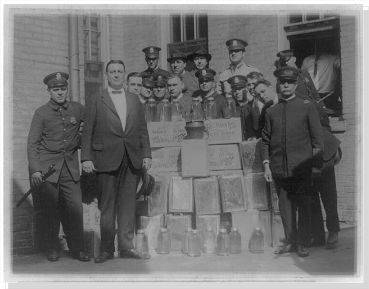 Washington DC:  Policemen with cases of moonshine.